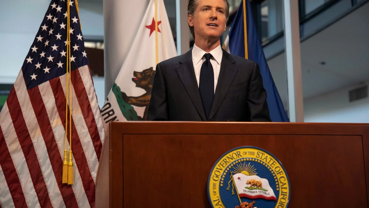 Gavin Newsom speaking at a podium.