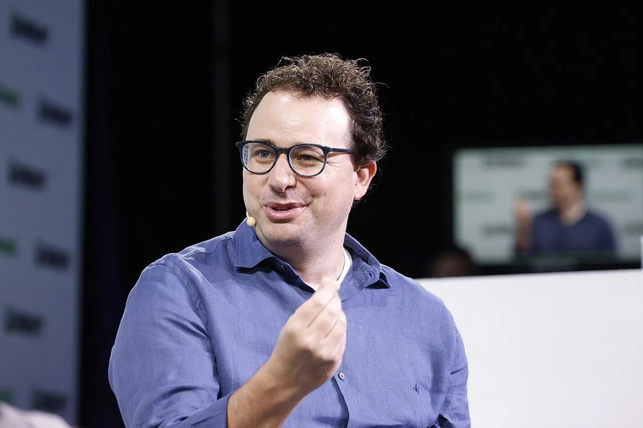 Dario Amodei speaking onstage at TechCrunch Disrupt 2023.
