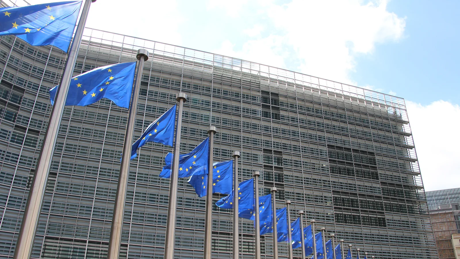 European Union flags outside the Berlaymont building, headquarters of the European Commission in Brussels.