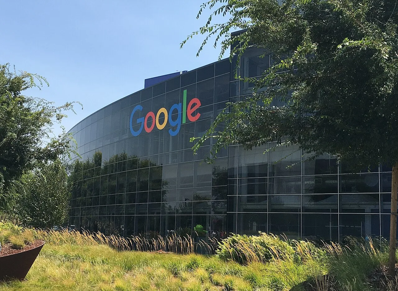 A cropped view of a Google headquarters building with the Google logo visible.