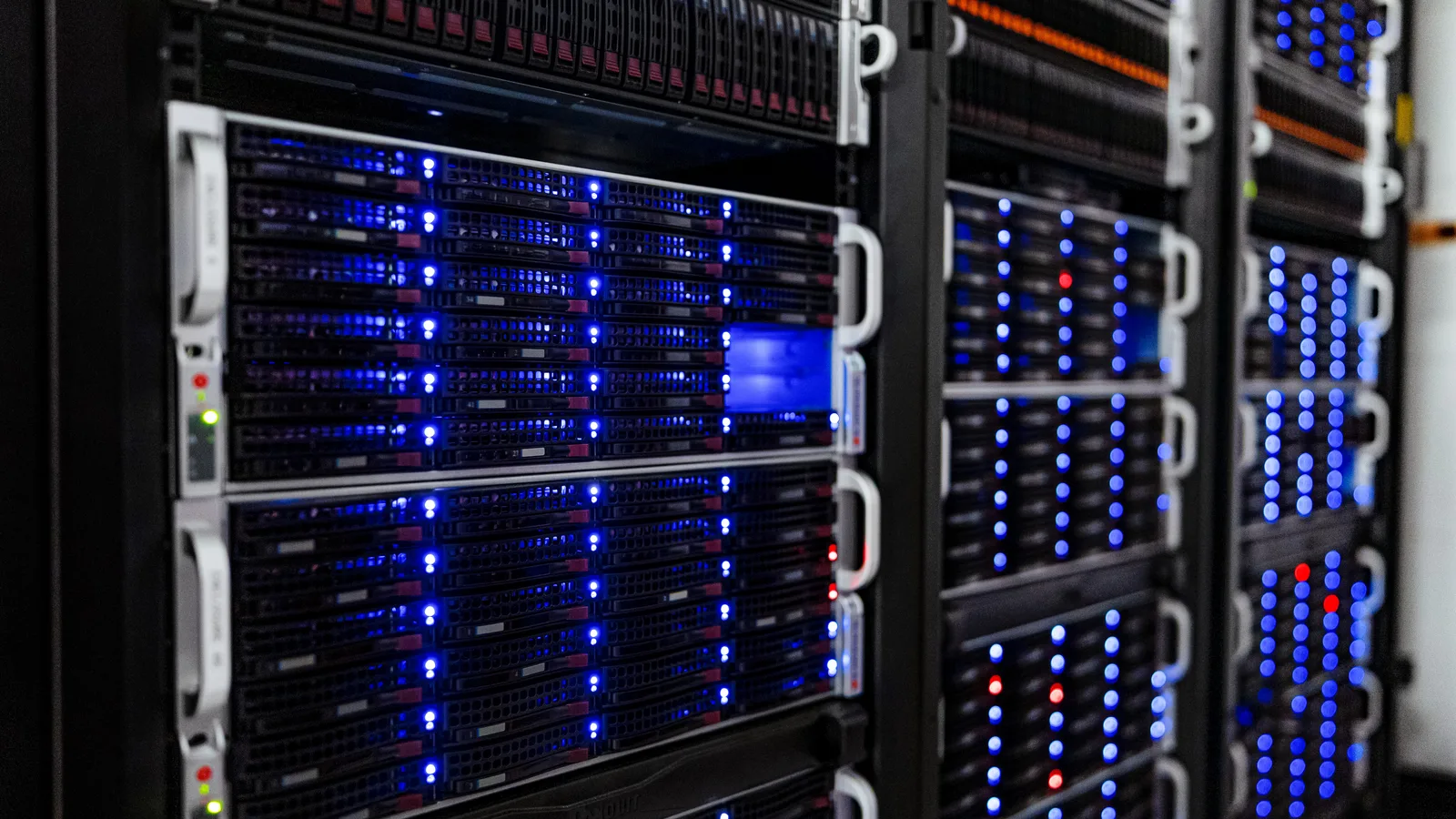 Rows of illuminated server racks in the NOIRLab headquarters computer server room in Tucson, Arizona.